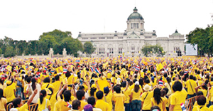 Thai people in yellow shirts