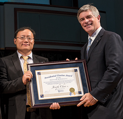 Joseph Chen with President Patrick T. Harker receiving the presidential citation