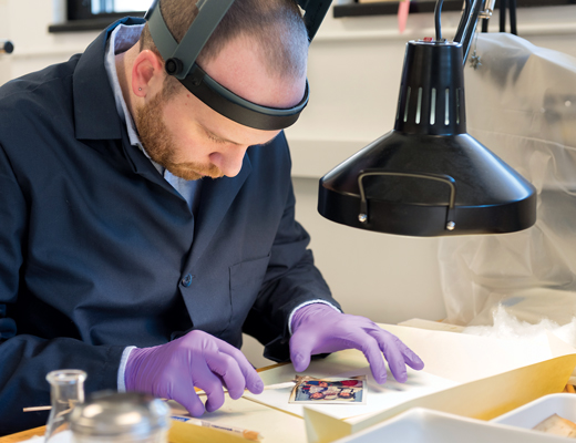 Doctoral student Michael Emmons restores family photos for his friend Ricky Harris