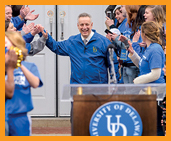 Image of President Assanis welcomed by students