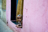 child looking out a window