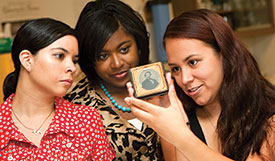 Students looking at a daguerrotype