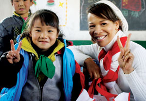 Lisa Rochester with a child in China