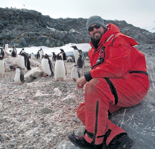Matt Oliver with gentoo penguins