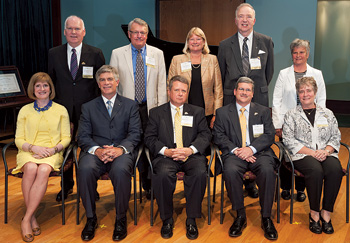 Seated, from left, UDAA President Darelle Riabov, UD President Patrick Harker and Wall of Fame inductees William Carpenter, John Collins and Margaret Loew Craft, and standing, from left, Scott Goodell, David Helwig, Evelyn Maurmeyer, Gordon Pfeiffer and Janet Smith.