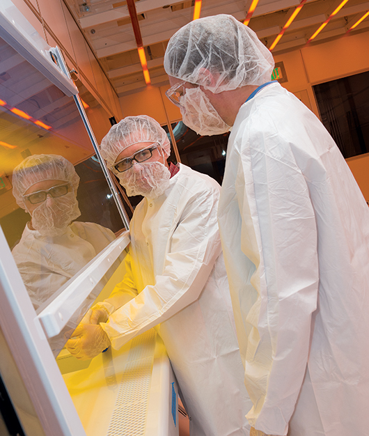 Julian Codreanu, UD’s Nanofabrication Facility manager, gives visitors an early look at the clean room that will be operating in ISE Lab. With a state-of-the-art design and construction to eliminate most contaminants typically found in the air, the clean room meets the high standards required for nanofabrication, in which even a speck of dust can ruin the research at such tiny dimensions. The new facility is expected to be used by scientists not just from UD but also from other institutions and from industry.