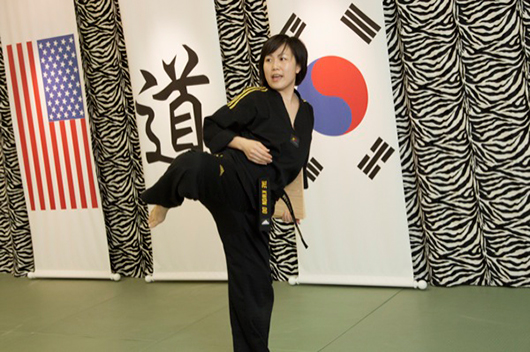 Mi Jung Choi demonstrates the proper form for a kick.