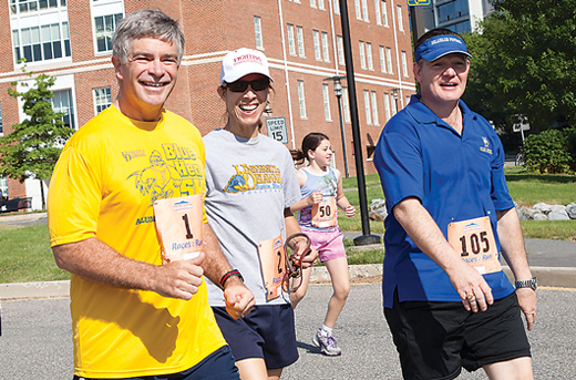 Kenneth Jones at last year’s Alumni weekend 5K with President Harker and Emily Harker