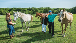 Stuart and Suzanne Grant with a horse and CANR student