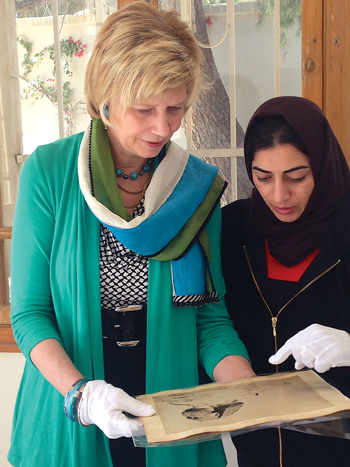 Debra Hess Norris (left) leads a photo preservation workshop in Jordan.