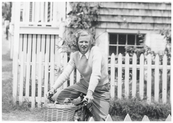 archive photo of Dot Munroe on a bike