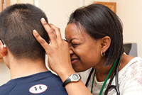 a patient being examined by a nurse at the nurse managed health care facility