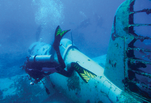 image of diver with undersea wreckage