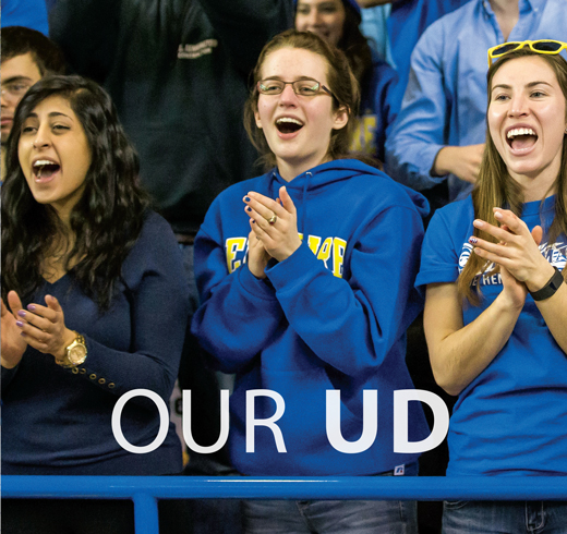 Our UD title page-image of students cheering at a basketball game