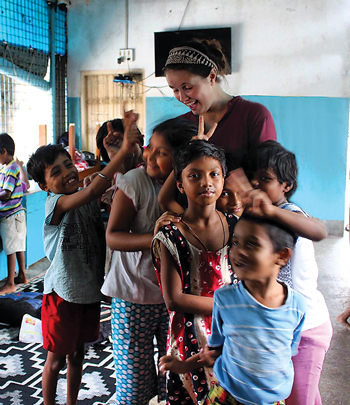 Olivia Blythe with students in India