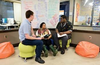3 students discussing a project in the Venture Development Center