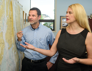 image of James Kendra and Tricia Wachtendorf looking at a map