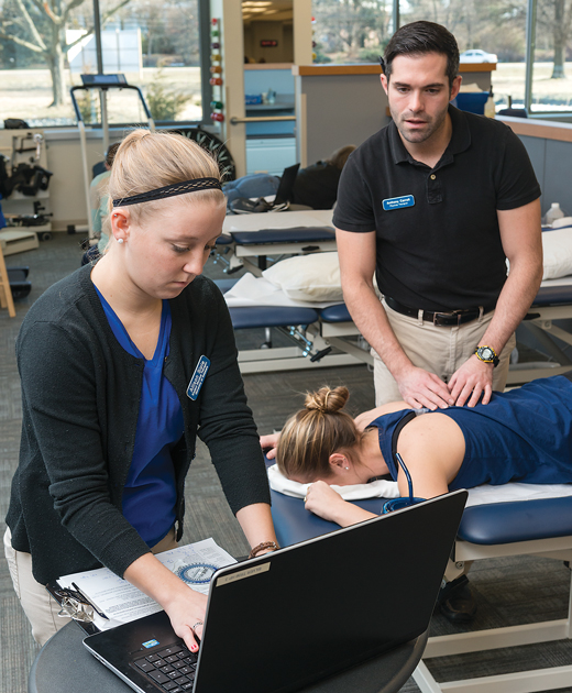 image of two UD physical therapists working on a patient