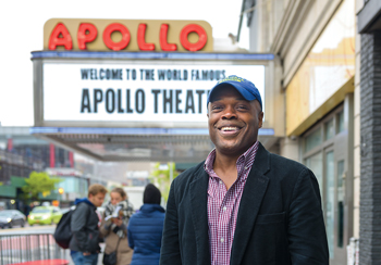 >Ty Jones in front of the Apollo Theater