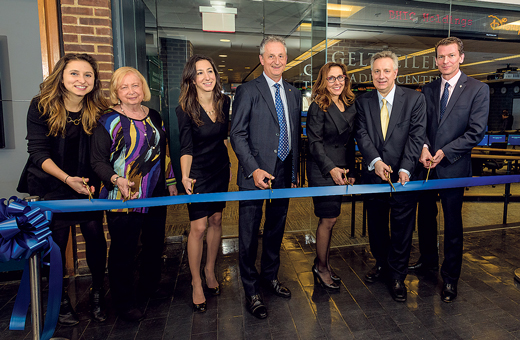 From left: Jennifer, Lori, Melissa, Michael and Rosann Geltzeiler, President Dennis Assanis and Bruce Weber, dean of Lerner College of Business and Economics